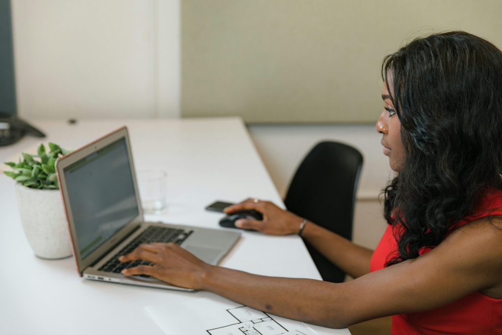 woman reading something on a laptop